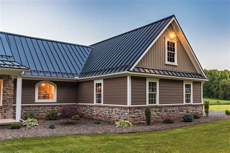 bronze metal roof on light green house|dark metal roof color.